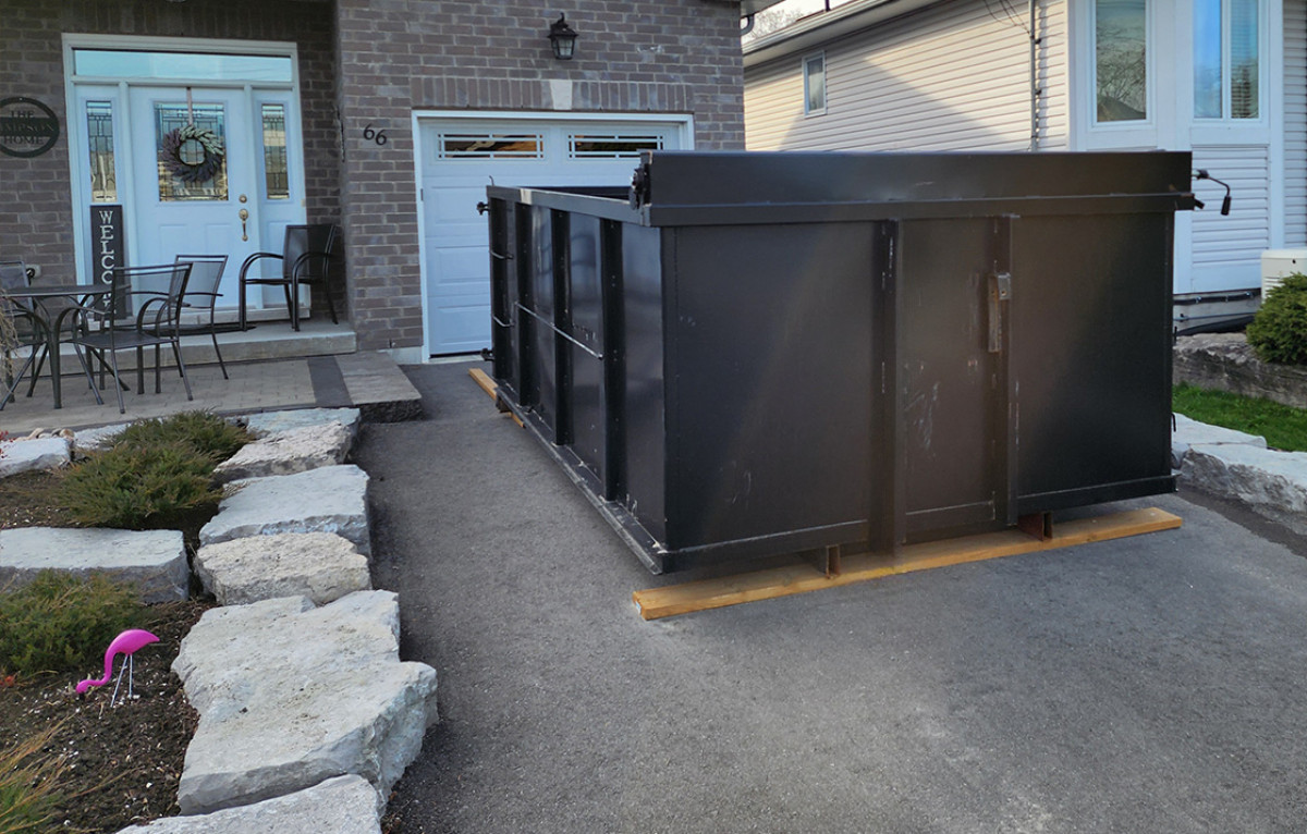 Dumpster Bin in Driveway